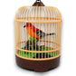 Mellow Monkey sound-activated singing bird toy in a decorative plastic cage with a bright orange and black bird