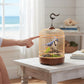Mellow Monkey motion-activated blue and white singing bird in a decorative cage on a wooden table