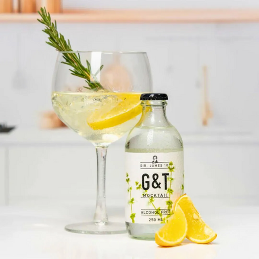 Mellow Monkey Sir. James 101 alcohol-free gin and tonic bottle served in a glass with lemon and rosemary garnish