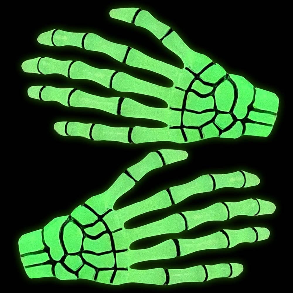 Mellow Monkey glow in the dark skeleton hand hairslides in bright neon green for spooky goth festival hair styling.