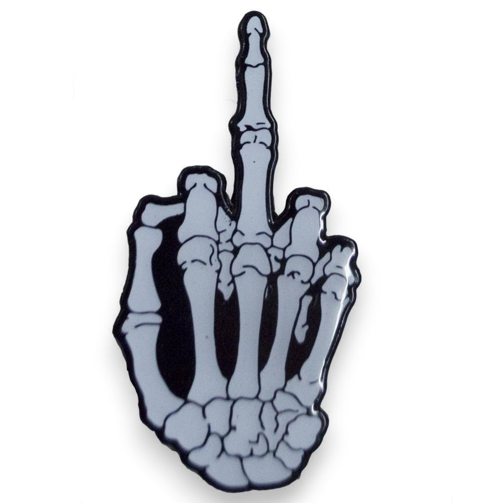 Mellow Monkey skeleton hand middle finger enamel pin with a glossy finish and glow-in-the-dark effect.