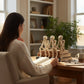 Mellow Monkey resin skeleton shelf sitters in see, hear, and speak no evil poses sitting on books at a desk