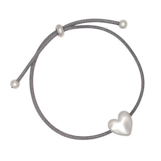 Mellow Monkey slate blue cord bracelet featuring a polished silver heart charm, nickel and lead-free coastal jewelry.