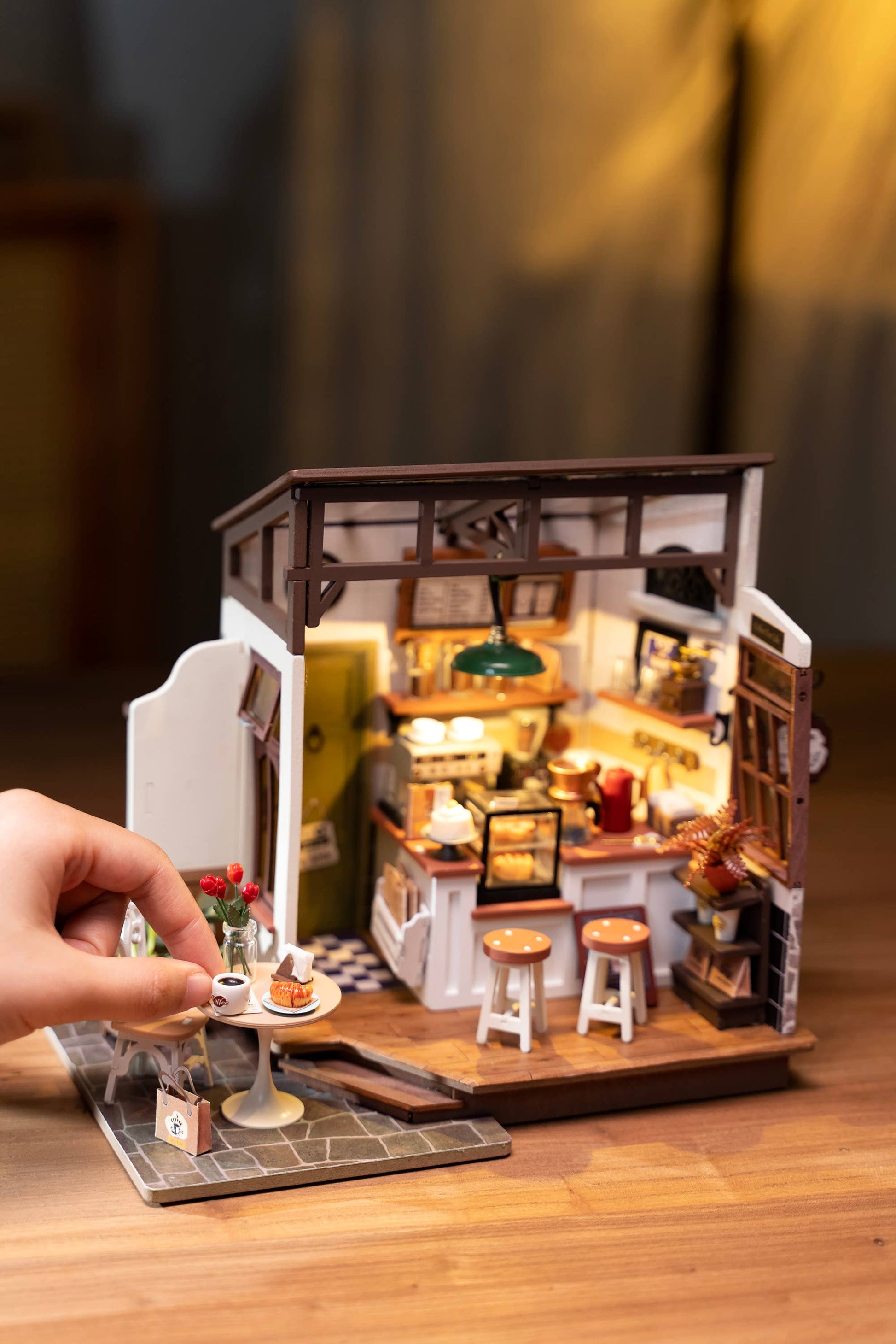 Mellow Monkey Slow Life Café DIY miniature house kit with detailed bistro interior, furniture, and warm lighting.