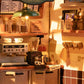 Mellow Monkey Slow Life Café DIY miniature house kit featuring a detailed coffee shop interior with warm lighting.