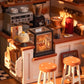 Mellow Monkey Slow Life Café DIY miniature house kit featuring a detailed coffee shop counter with stools and pastries