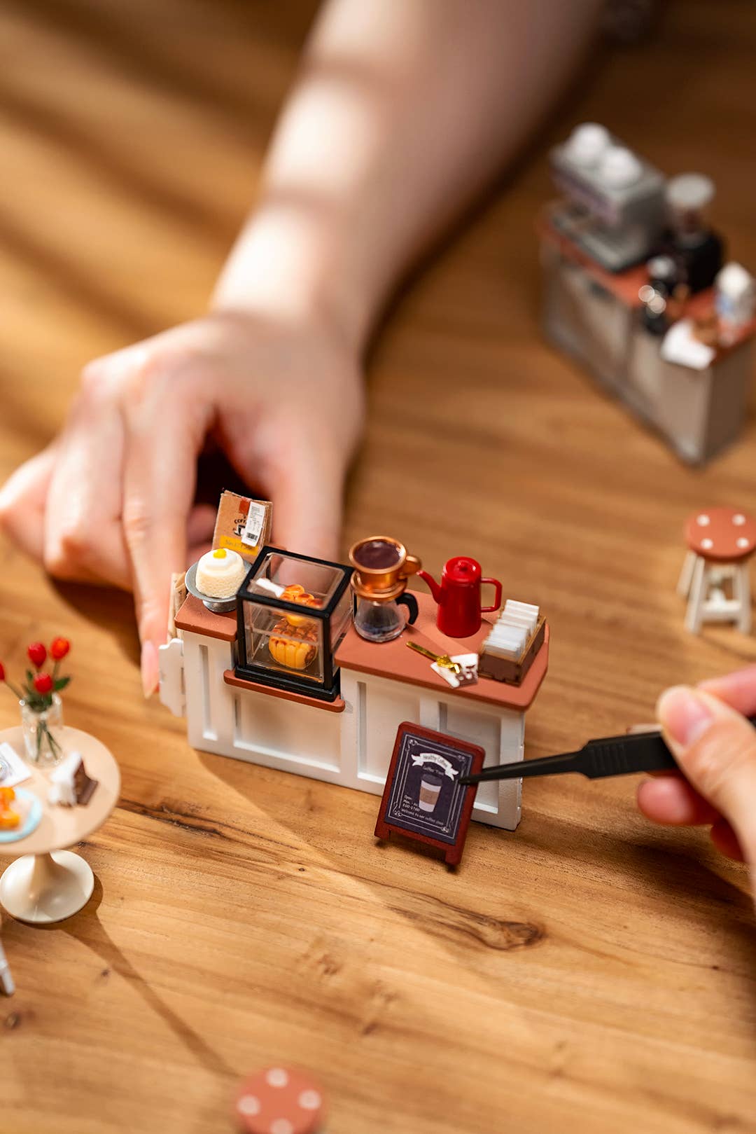 Mellow Monkey Slow Life Café DIY miniature house kit with tiny coffee shop counter, pastries, and accessories.