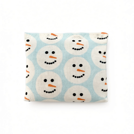 Mellow Monkey Mantra Beads sensory calm bag featuring a light blue fabric with a repeating snowman face pattern.