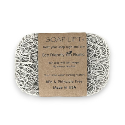 Mellow Monkey Soap Lift soap saver in grey, a multi-directional bioplastic pad that keeps bar soap dry and clean.