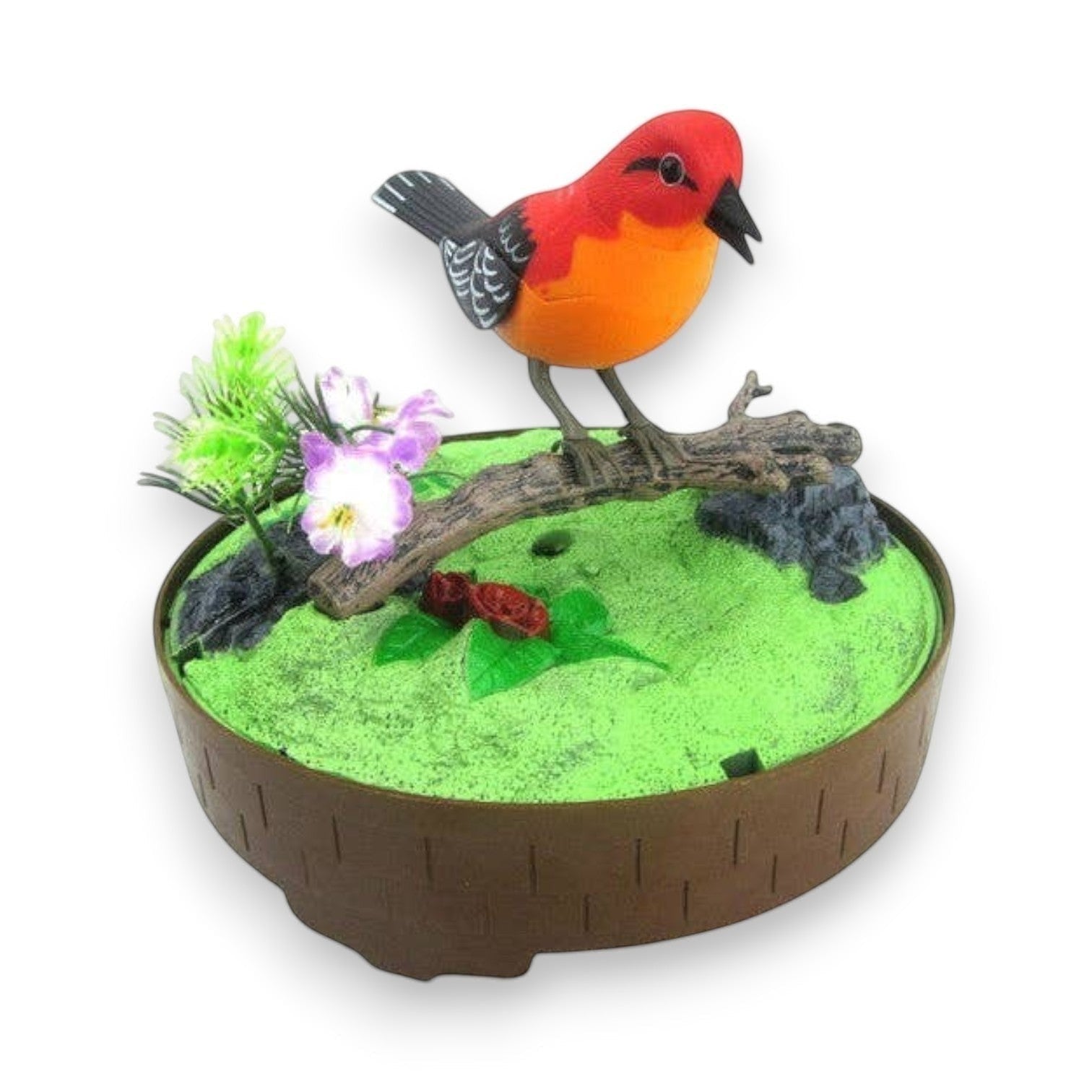 Mellow Monkey sound-activated singing bird toy with red and orange feathers perched on a branch with flowers