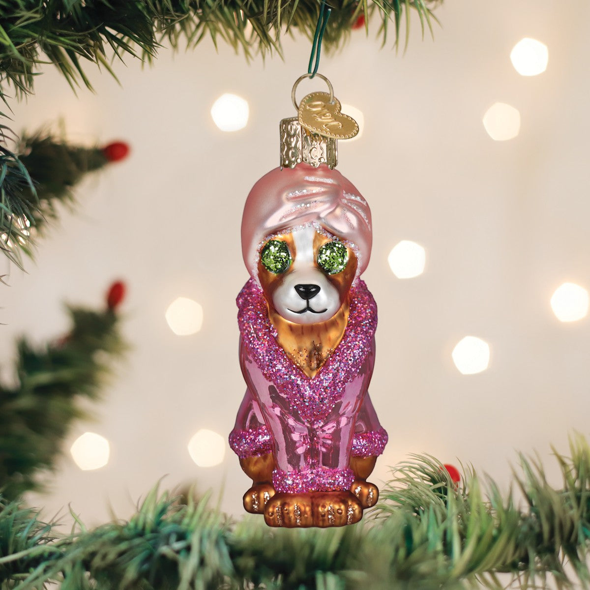 Mellow Monkey Spa Dog blown glass ornament, a pampered pup wearing a pink robe and turban, with glittery green eyes.