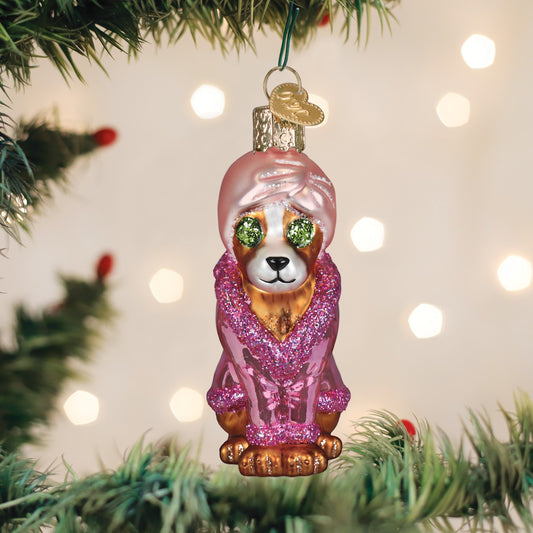 Mellow Monkey Spa Dog blown glass ornament, a pampered pup wearing a pink robe and turban, with glittery green eyes.