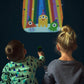 Two children using a Mellow Monkey space-themed storybook flashlight to project an alien party scene on a wall.