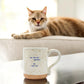 Mellow Monkey ceramic mug with speckled finish and You Are Not Terrible quote, featuring a cat in the background.