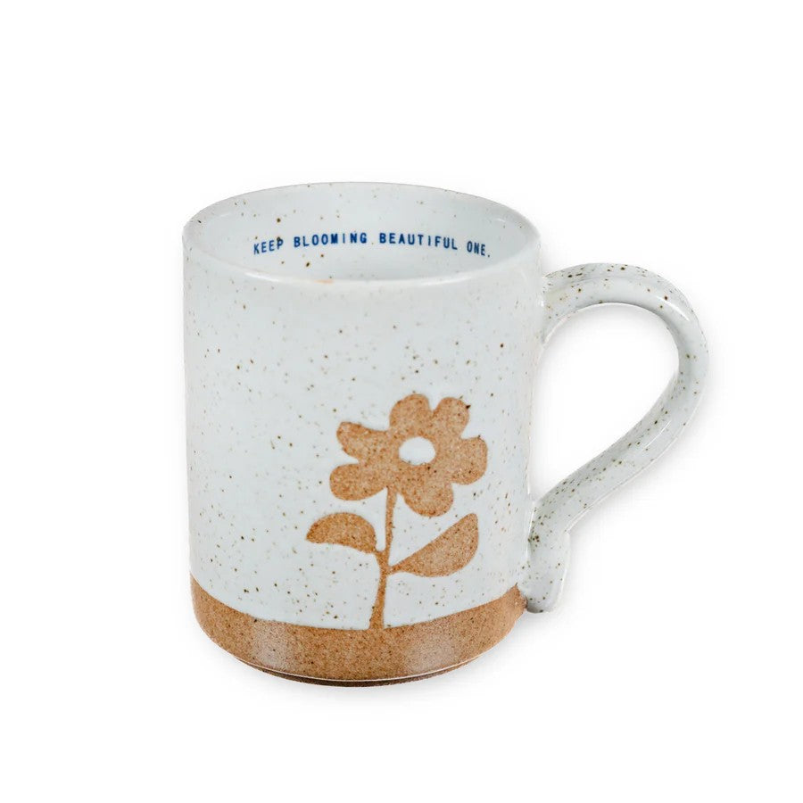 Mellow Monkey speckled stoneware mug with a hand-carved flower design and Keep Blooming Beautiful One quote inside.