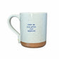 Mellow Monkey speckled stoneware coffee mug with the quote Wake Up. Drink Coffee. Plot Goodness. in blue text.