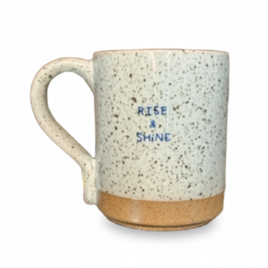 Mellow Monkey speckled stoneware mug featuring the Rise & Shine quote in a handmade, rustic design.