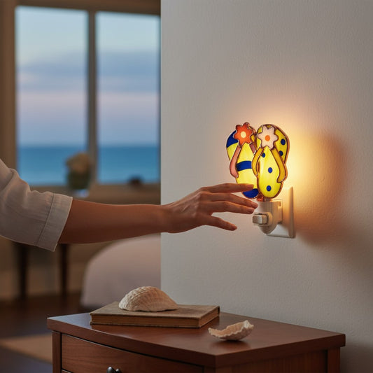 Mellow Monkey stained glass nightlight shaped like colorful flip flops with copper finish, plugged into a wall outlet.