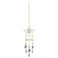 Mellow Monkey star-shaped suncatcher with crystals, healing stones, and gold chains hanging in a window.