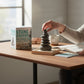 Mellow Monkey Stone Stacking desktop kit with hematite stones, beechwood tray, and sand for mindful stress relief.
