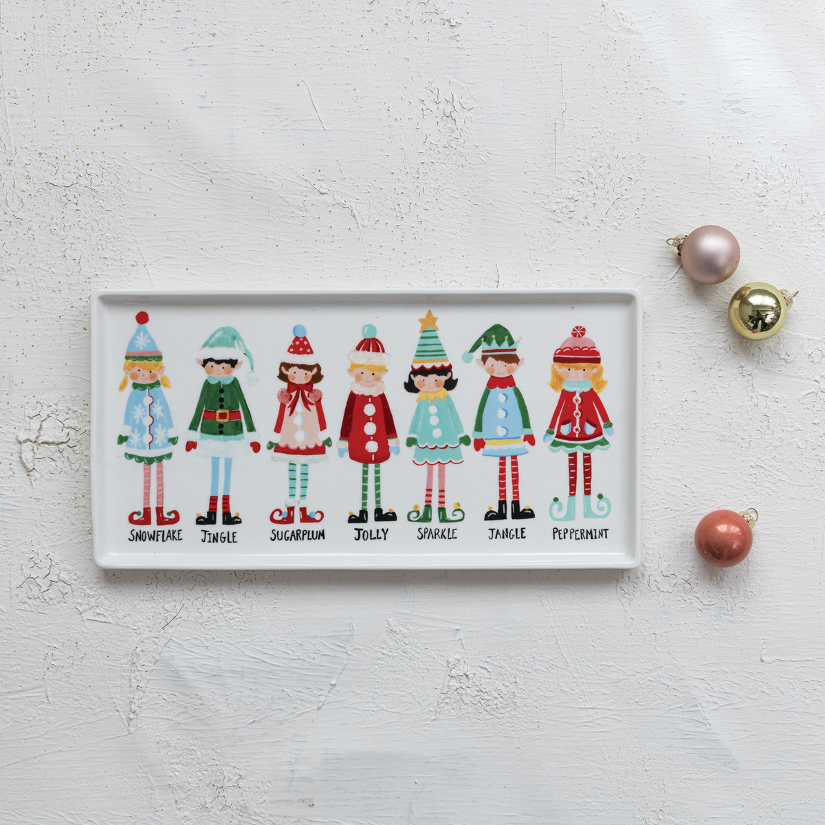 Mellow Monkey rectangular stoneware platter featuring a colorful illustration of seven festive Santa's elves.