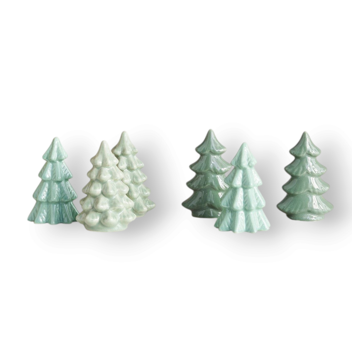 Mellow Monkey set of six small green stoneware Christmas tree figurines in three subtle shades for holiday decor.