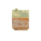 Mellow Monkey handcrafted stoneware house-shaped incense burner with a reactive green and ochre glaze and base.