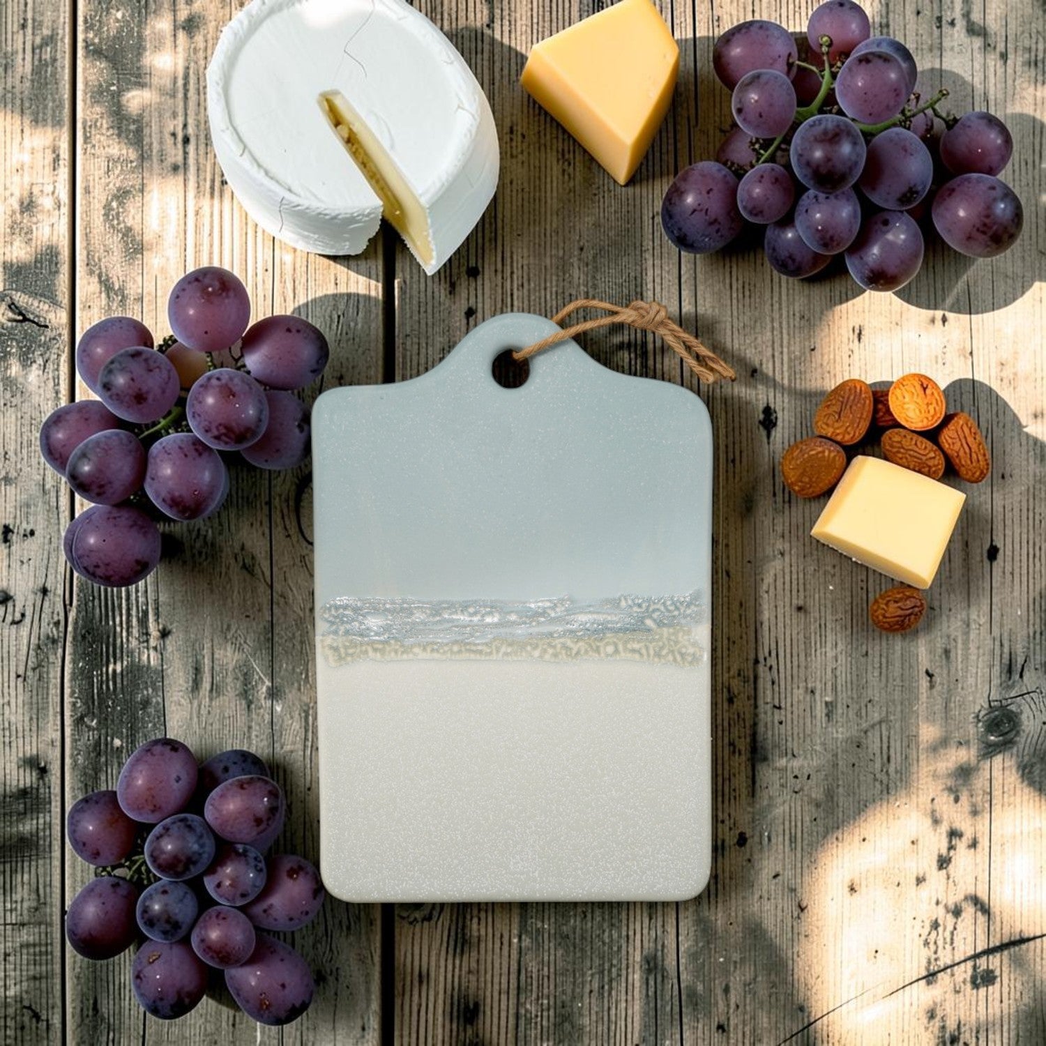 Mellow Monkey stoneware serving board in blue and white with a rustic jute tie for hanging