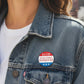 Mellow Monkey Stop Electing Assholes 1.25" pin-back button with red, white, and blue design and three stars.