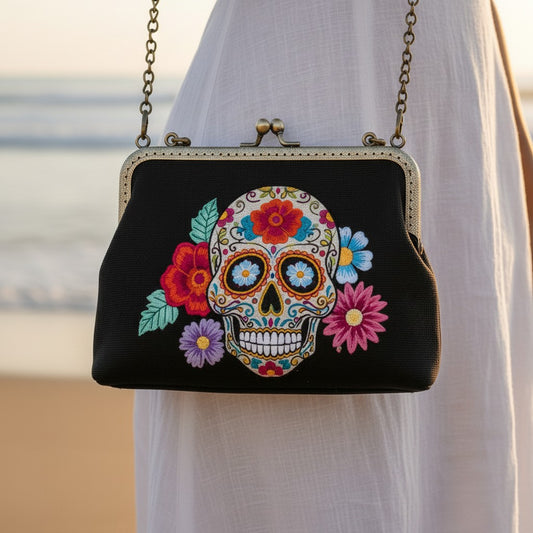 Mellow Monkey sugar skull kiss lock bag in black linen cotton blend with colorful floral embroidery and chain strap