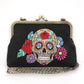 Mellow Monkey sugar skull kiss lock bag in black linen cotton blend with vintage metal hardware and chain strap