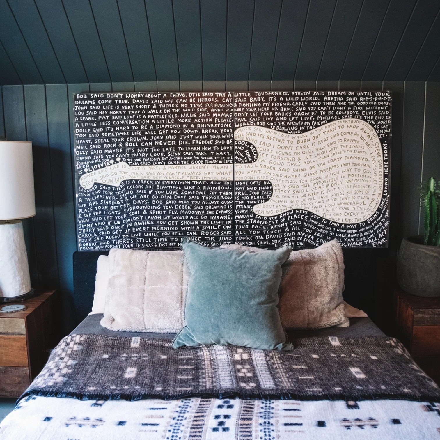 Mellow Monkey Sugarboo Legends two-piece guitar wall art with music lyrics on a black background above a bed