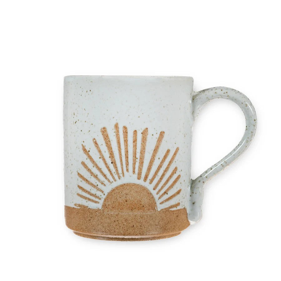 Mellow Monkey speckled stoneware mug featuring a hand-carved sun design in earthy tones for a morning coffee ritual.