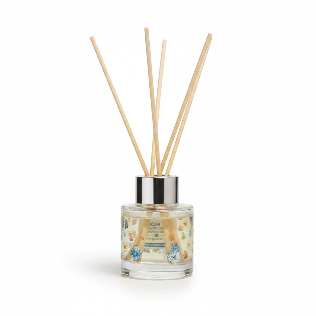 Mellow Monkey Sunwashed Cotton reed diffuser in a glass bottle with paw print design for neutralizing pet odors.