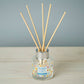 Mellow Monkey Pet House reed diffuser in Sunwashed Cotton scent with glass bottle and wooden reeds