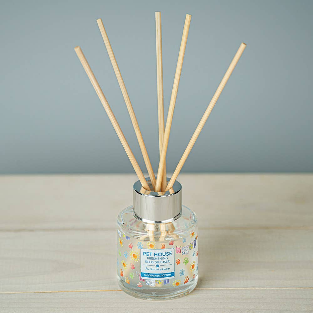 Mellow Monkey Pet House reed diffuser in Sunwashed Cotton scent with glass bottle and wooden reeds
