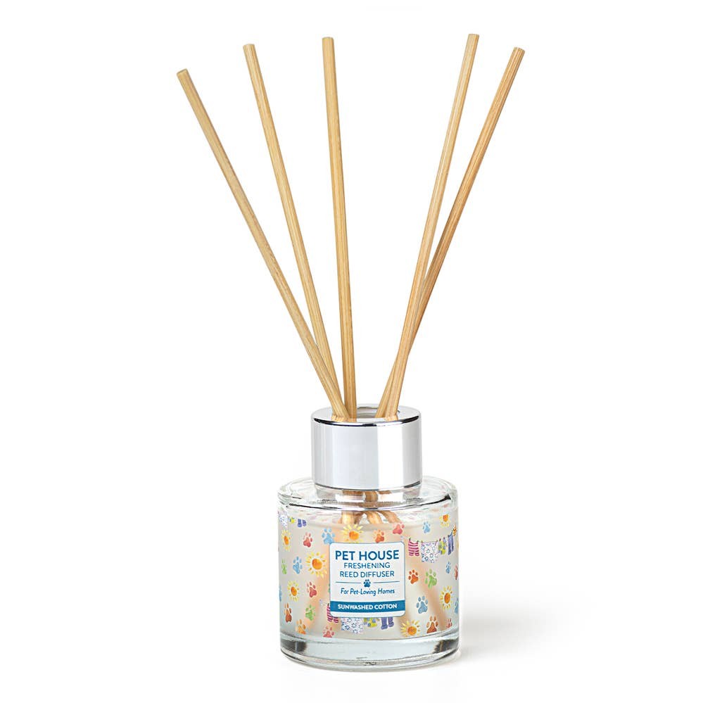 Mellow Monkey Pet House reed diffuser in Sunwashed Cotton scent with a glass bottle and wooden reeds