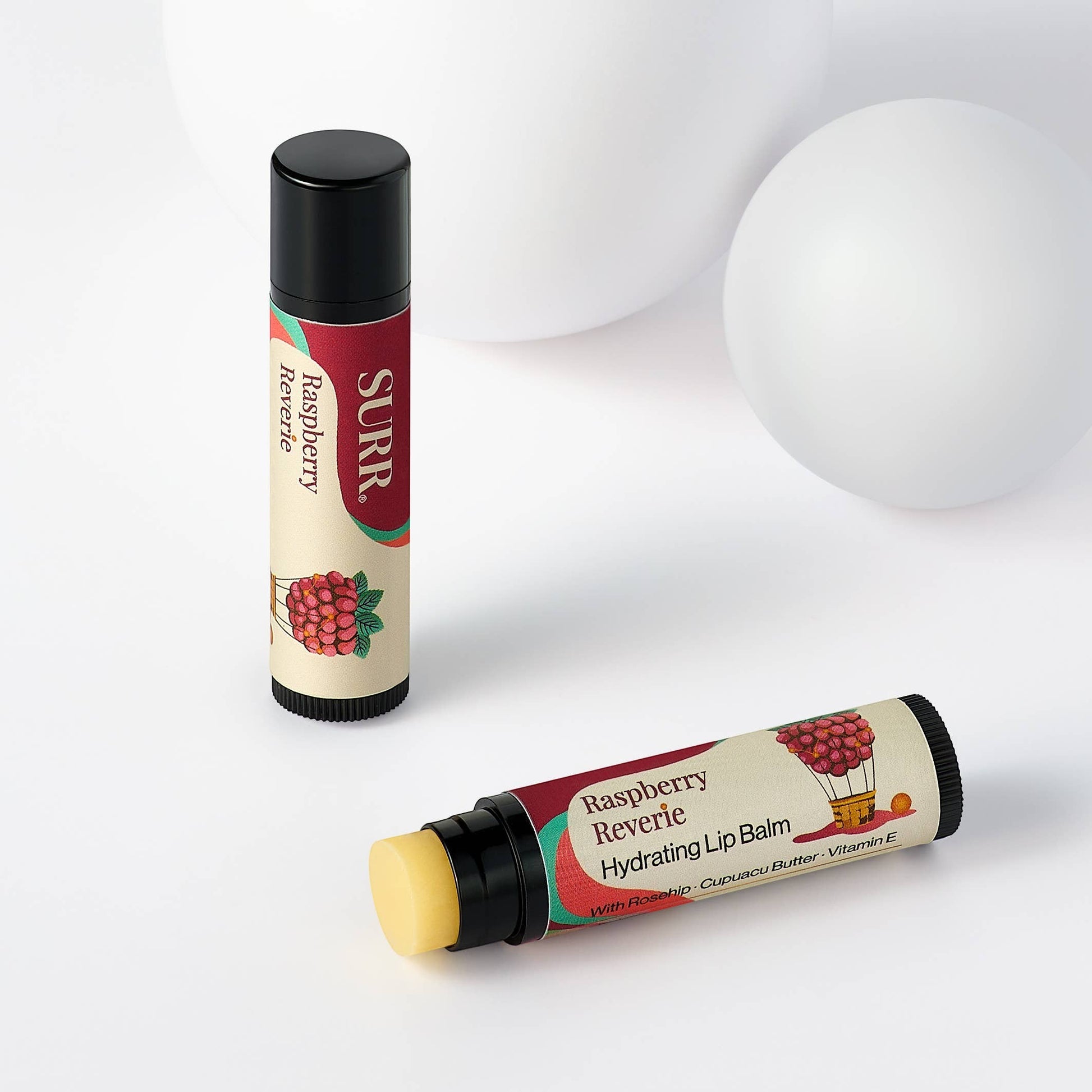 Mellow Monkey SURR Raspberry Reverie hydrating lip balm with rosehip, cupuacu butter, and vitamin E.