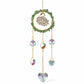 Mellow Monkey swan suncatcher with green healing stones, gold chains, and iridescent crystal hearts and prisms.