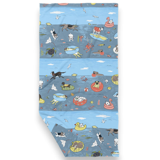 Mellow Monkey swimming dogs double-sided waffle dish towel, 18x30 inches, made from recycled polyester with a waffle texture. Features a fun, colorful print of dogs swimming and playing in the water.