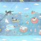Mellow Monkey swimming dogs double-sided waffle dish towel with colorful cartoon dogs and sea creatures on blue water background.