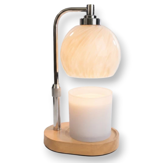 Mellow Monkey swirl blown glass candle warmer lamp with a brushed metal stem and natural wood base.
