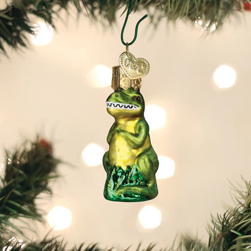 Mellow Monkey Mini T-Rex blown glass holiday ornament, green with gold crown and heart charm.