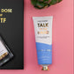 Mellow Monkey Talk to the Hand cypress and juniper scented hand cream in a white and blue tube with a gold cap.