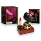 Mellow Monkey talking raven figurine on a skull and book with a candle, accompanied by a mini book and display box.