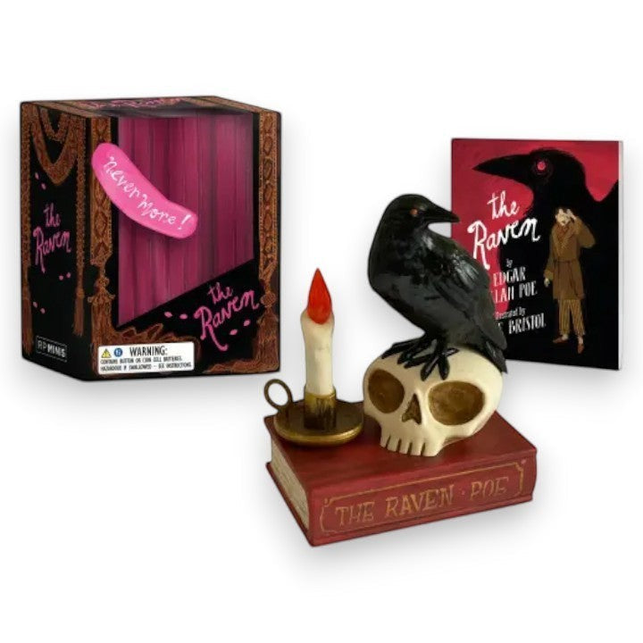 Mellow Monkey talking raven figurine on a skull and book with a candle, accompanied by a mini book and display box.