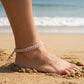 Mellow Monkey tan woven cotton nautical anklet worn on an ankle at the beach