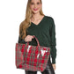 A woman holding a Mellow Monkey red and green tartan plaid nylon tote bag with a glossy finish.