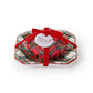 Mellow Monkey red currant scented French milled soap wrapped in tartan paper on a matching porcelain tray with red bow
