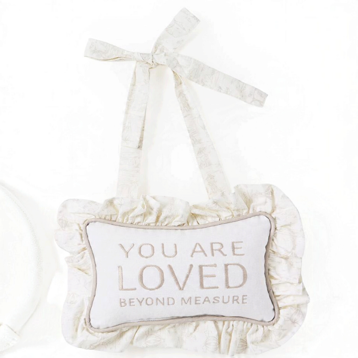 Mellow Monkey taupe cotton canvas door hanger with You Are Loved Beyond Measure embroidery and ruffle trim